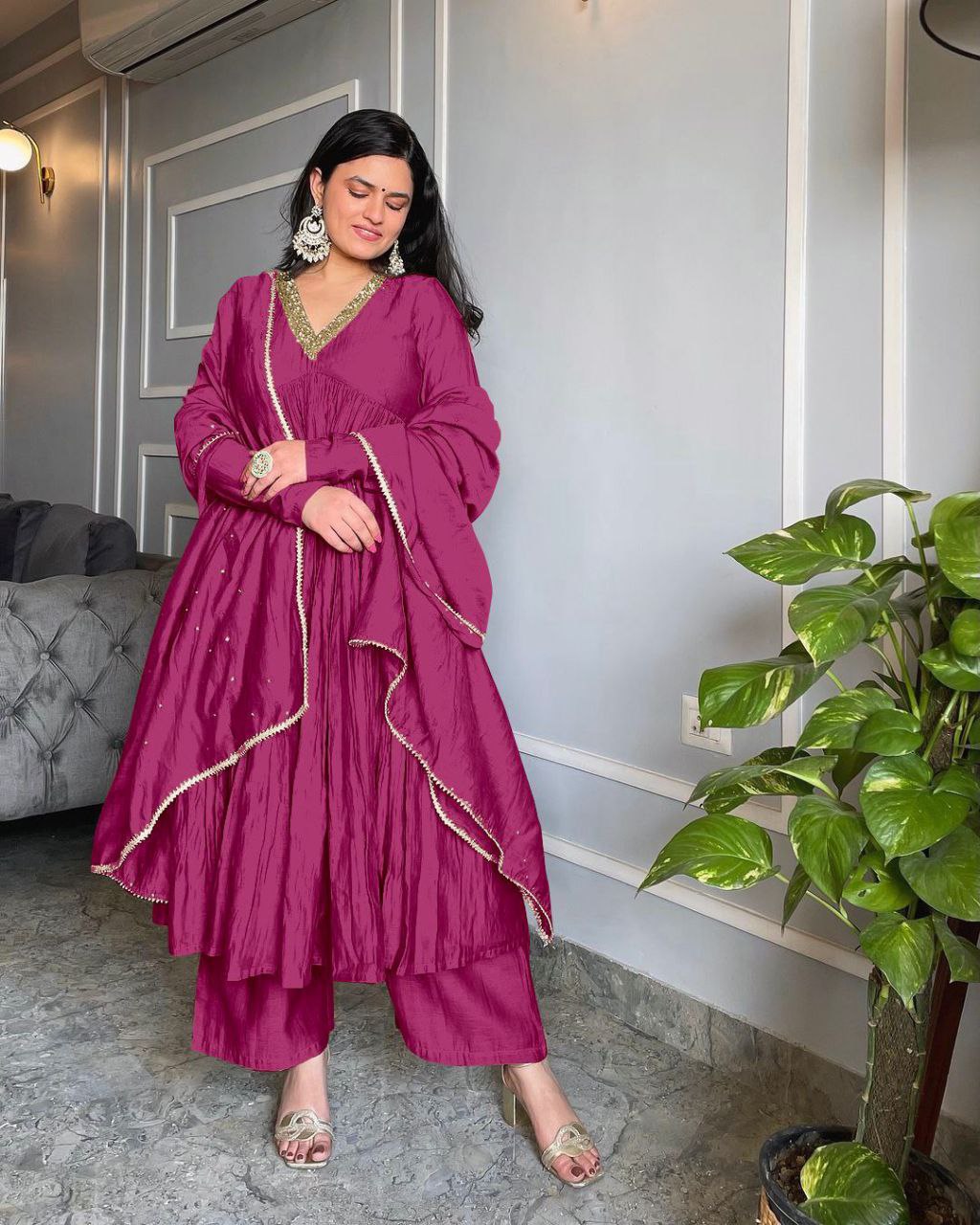 Lovely Wine Anarkali gown with flowing 3-meter flare, matching plazzo, and dupatta for an elegant look.