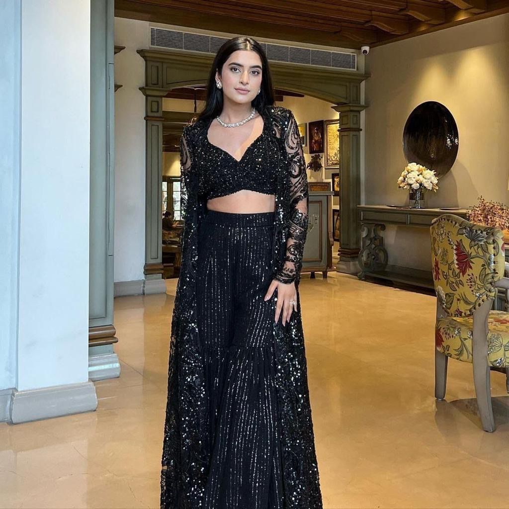 Full-length model shot in elegant butterfly net lehenga set