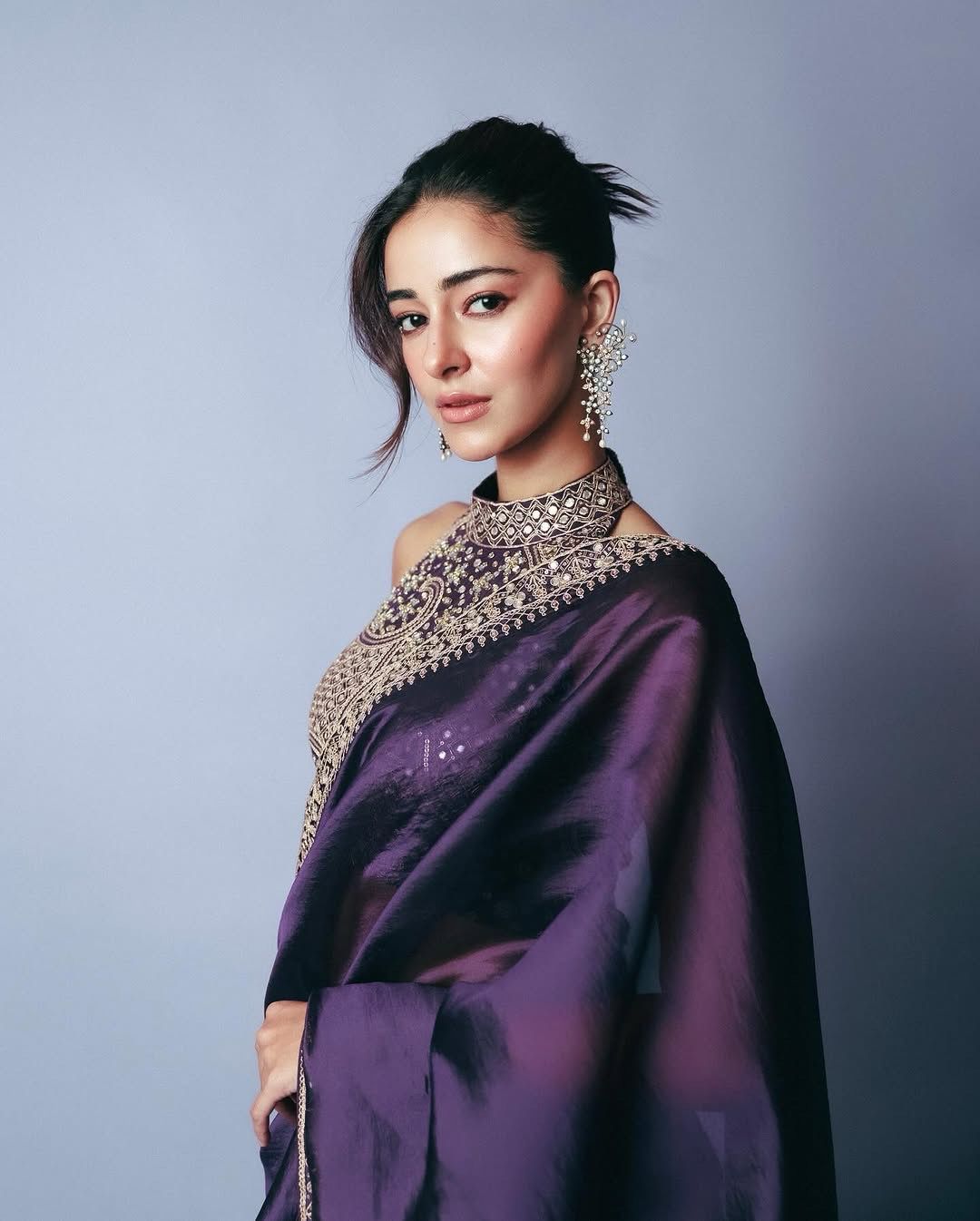 Side angle of saree showcasing embroidery and soft texture