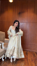 Detailed sequin embroidery and thread work on the Anarkali top