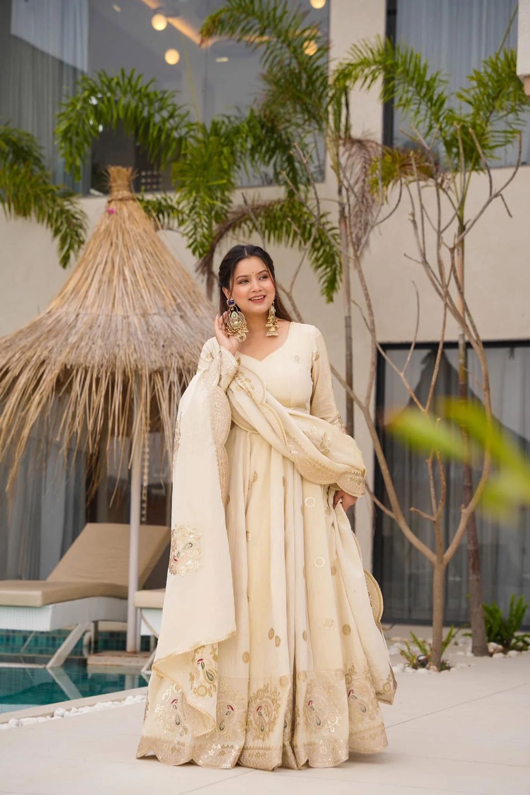 Elegant Chinon Silk gown with sequence coding, showcasing intricate details and a flattering silhouette.