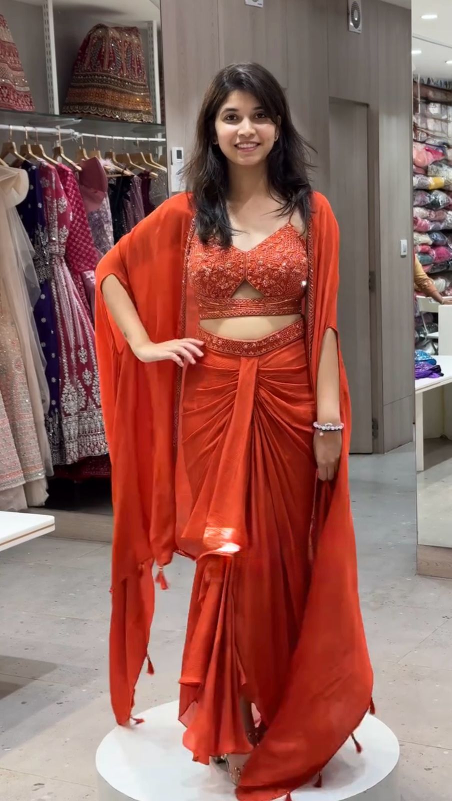 Full view of satin silk dhoti-style outfit with embroidered shrug and choli