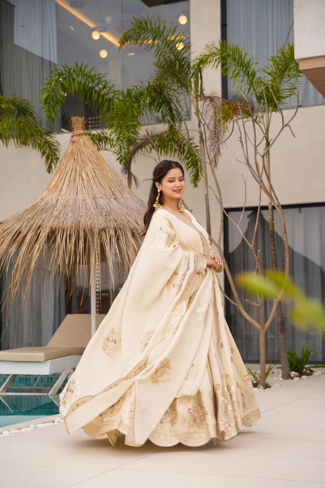 Elegant Chinon Silk gown with sequence coding, showcasing intricate details and a flattering silhouette.