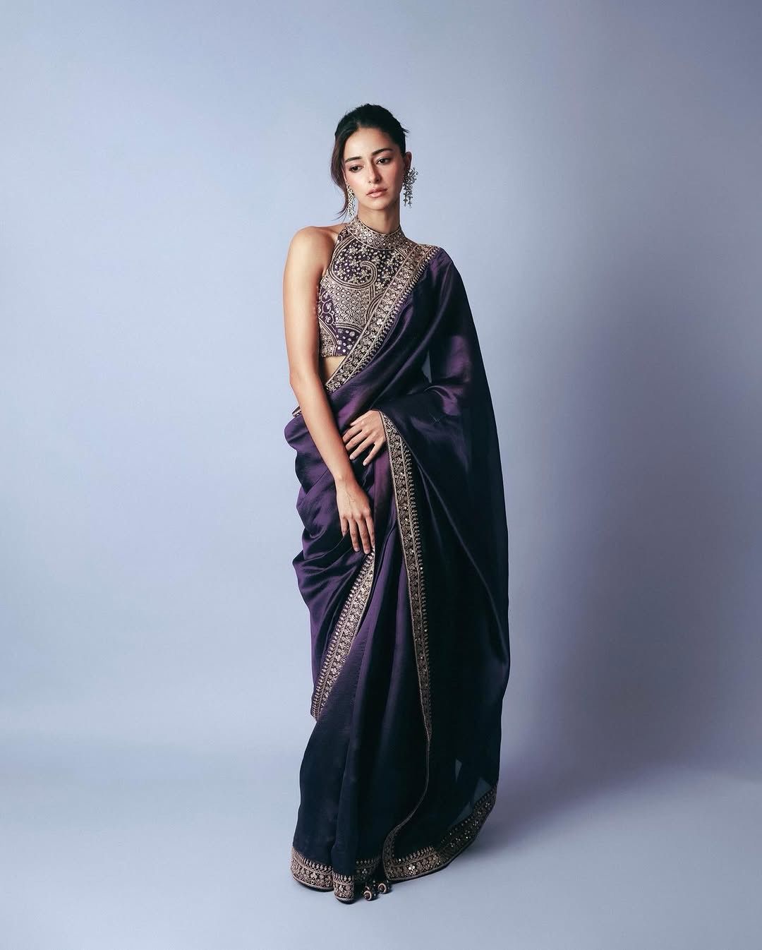 Full view of mauve embroidered saree styled for a wedding