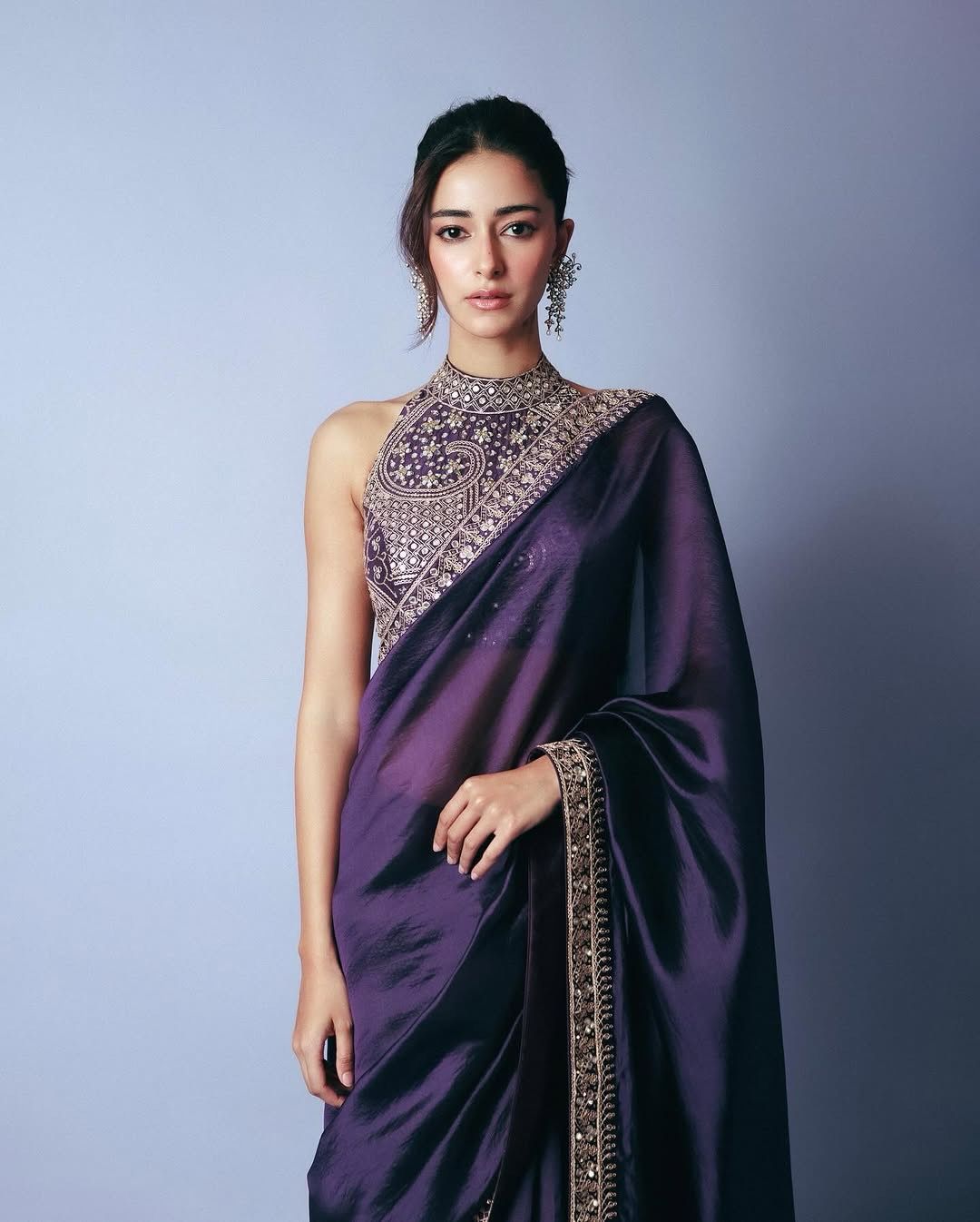 Elegant party-wear saree flatlay with blouse piece and embroidery details