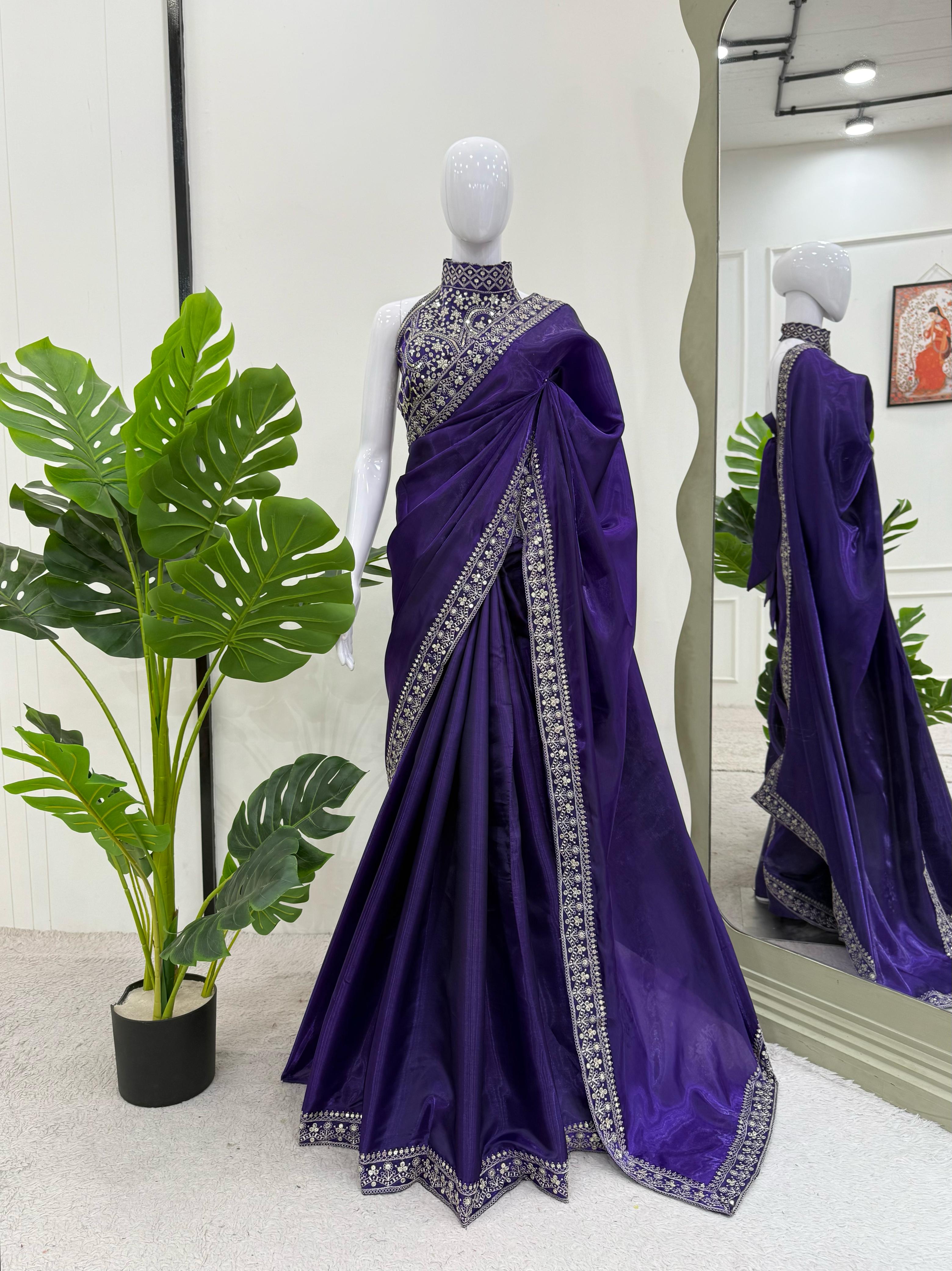 Model showcasing flowy silhouette of embroidered Jimmy Chu saree