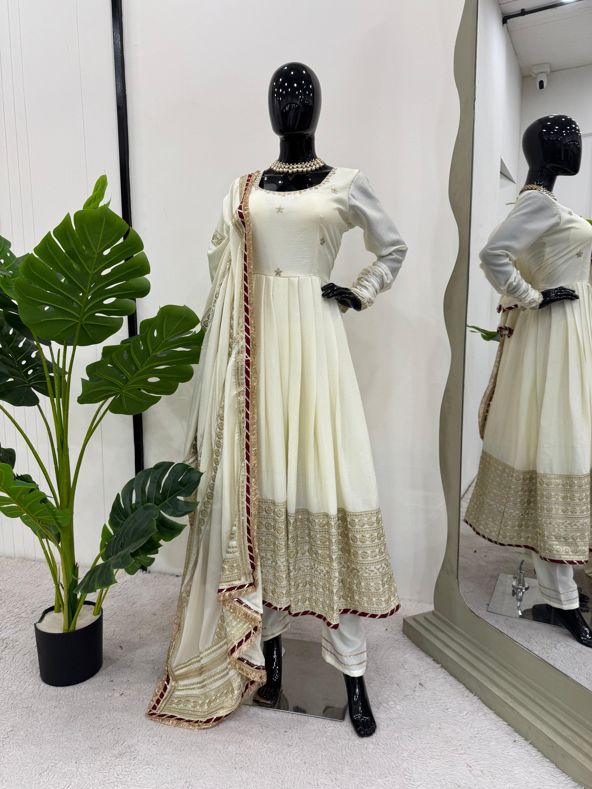 Full view of White Anarkali Set with embroidered details